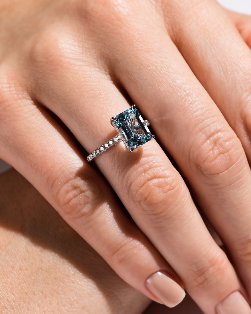 Aquamarine ring on a hand, fine jewellery photography