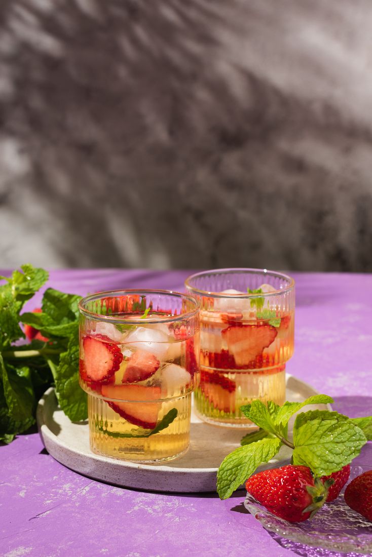 Strawberry mint cocktails on a purple surface, beverage photography Singapore