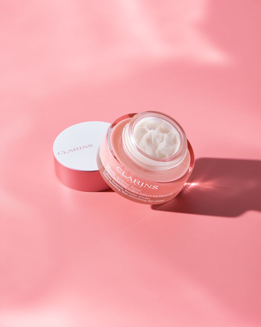 Pink skincare day cream jar, beauty product photography