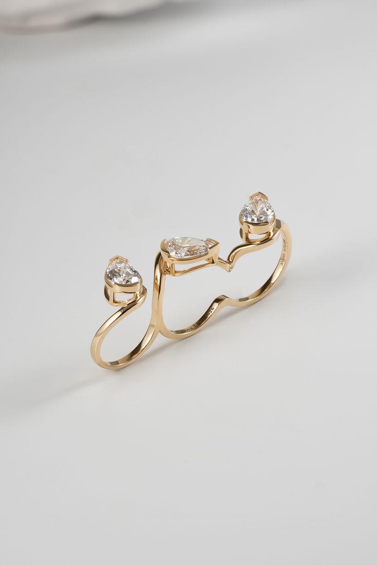 Gold two-finger ring with diamonds, jewellery product photography