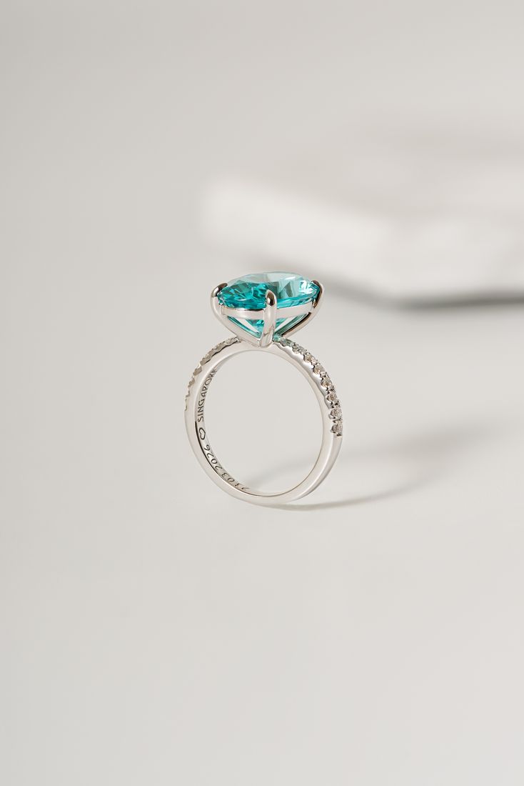 Teal gemstone ring with pave diamonds, jewellery photography Singapore